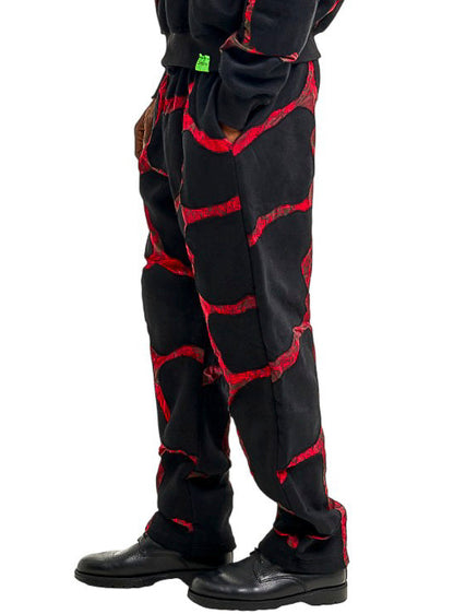 Person wearing a navy ski suit with a helmet on a white background
