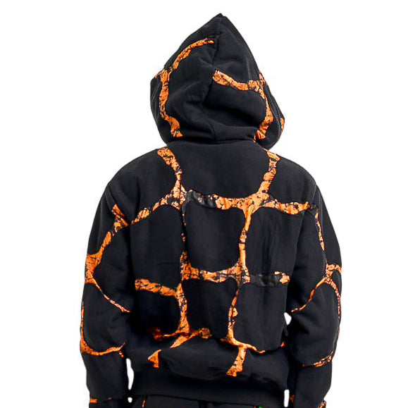 Black and orange tie-dye hoodie and pants set on a white background