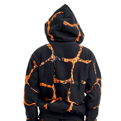Black and orange tie-dye hoodie and pants set on a white background